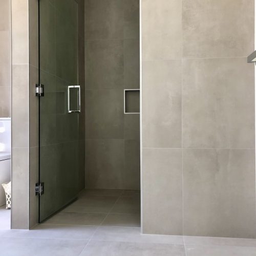 Interior Designer choosing tiles for your bathroom